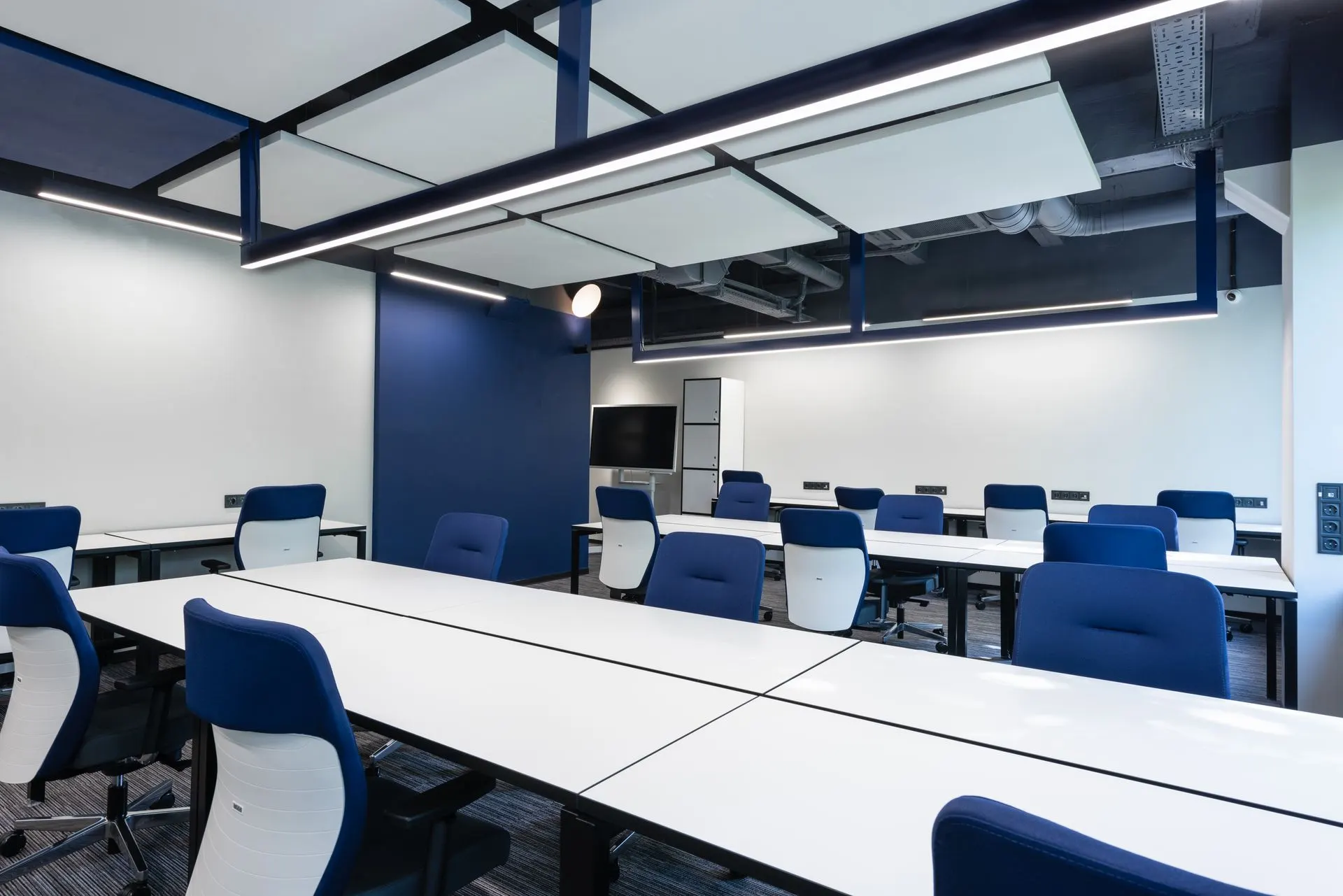Modern commercial office interior with ceiling lighting