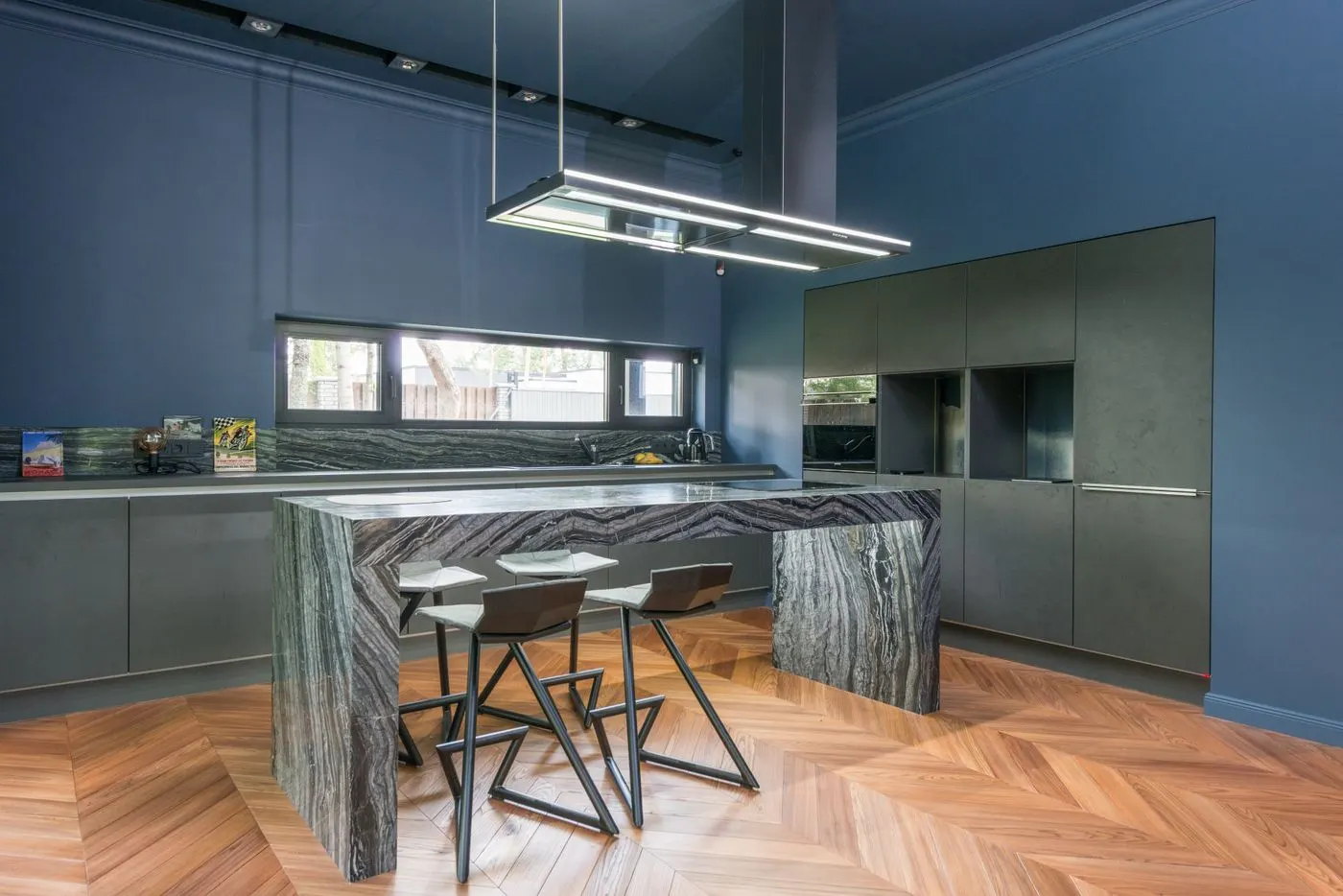 Modern kitchen with pendant and recessed lighting